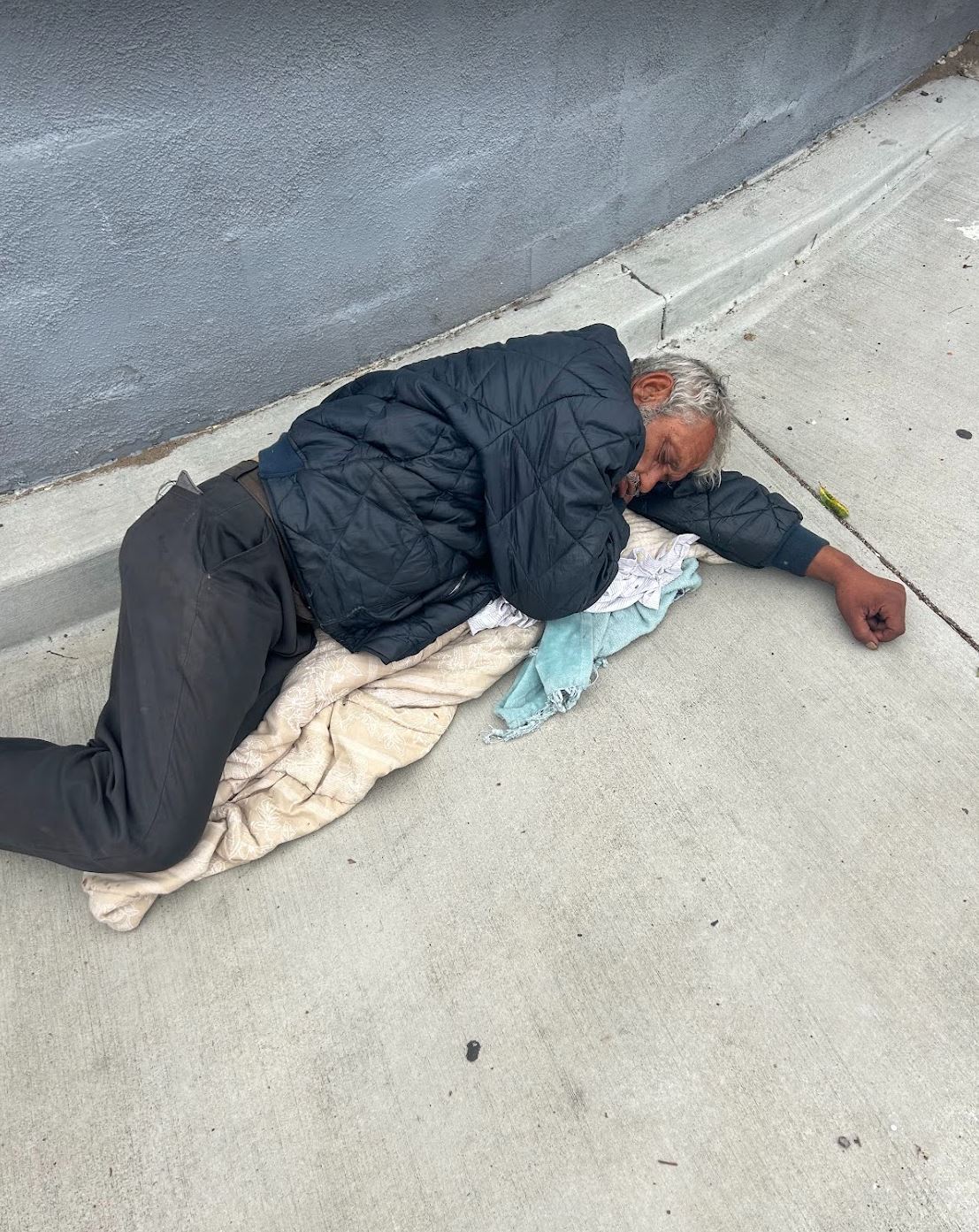 homeless man living on the street