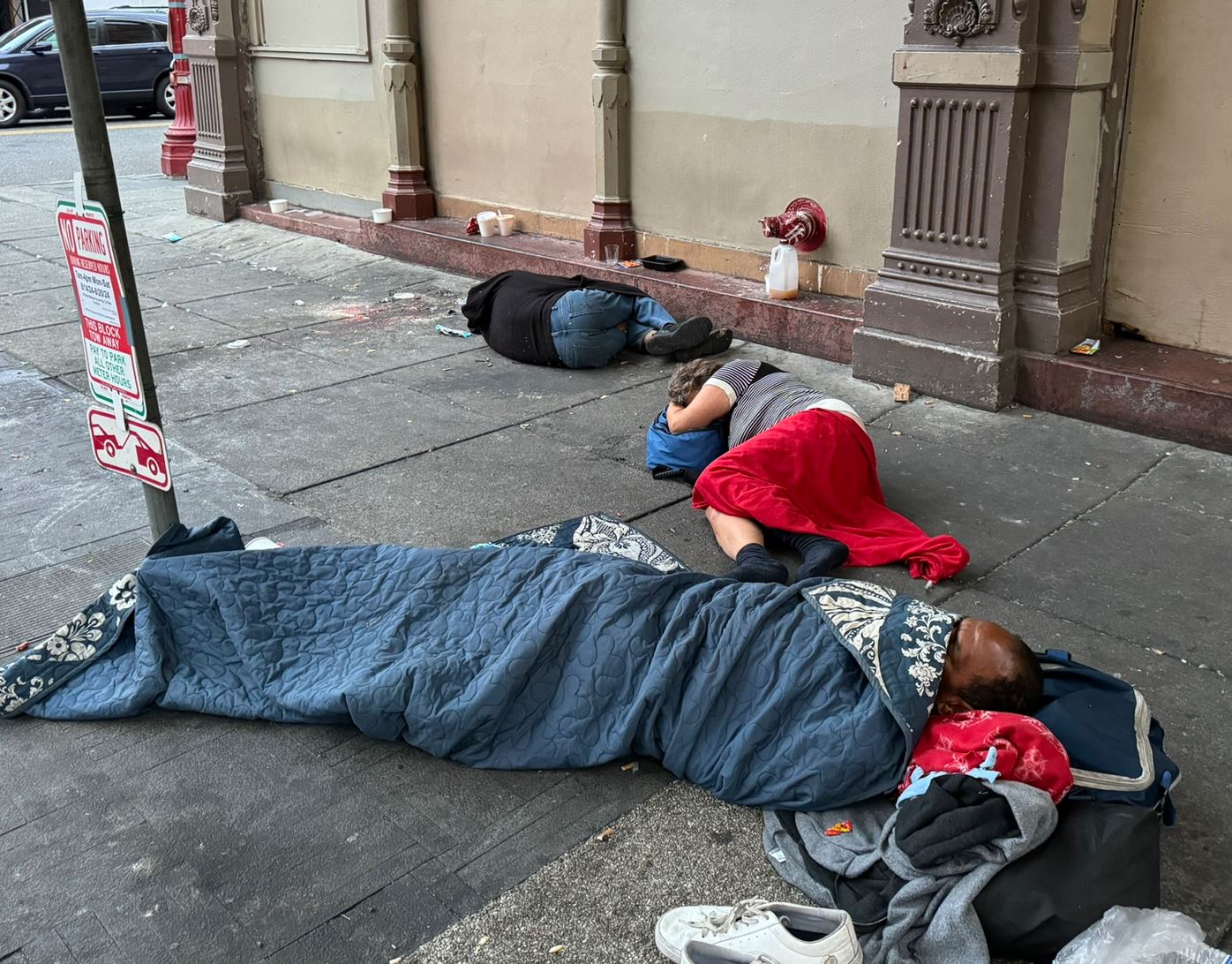 Homeless sleeping outsite PDX in Party Town